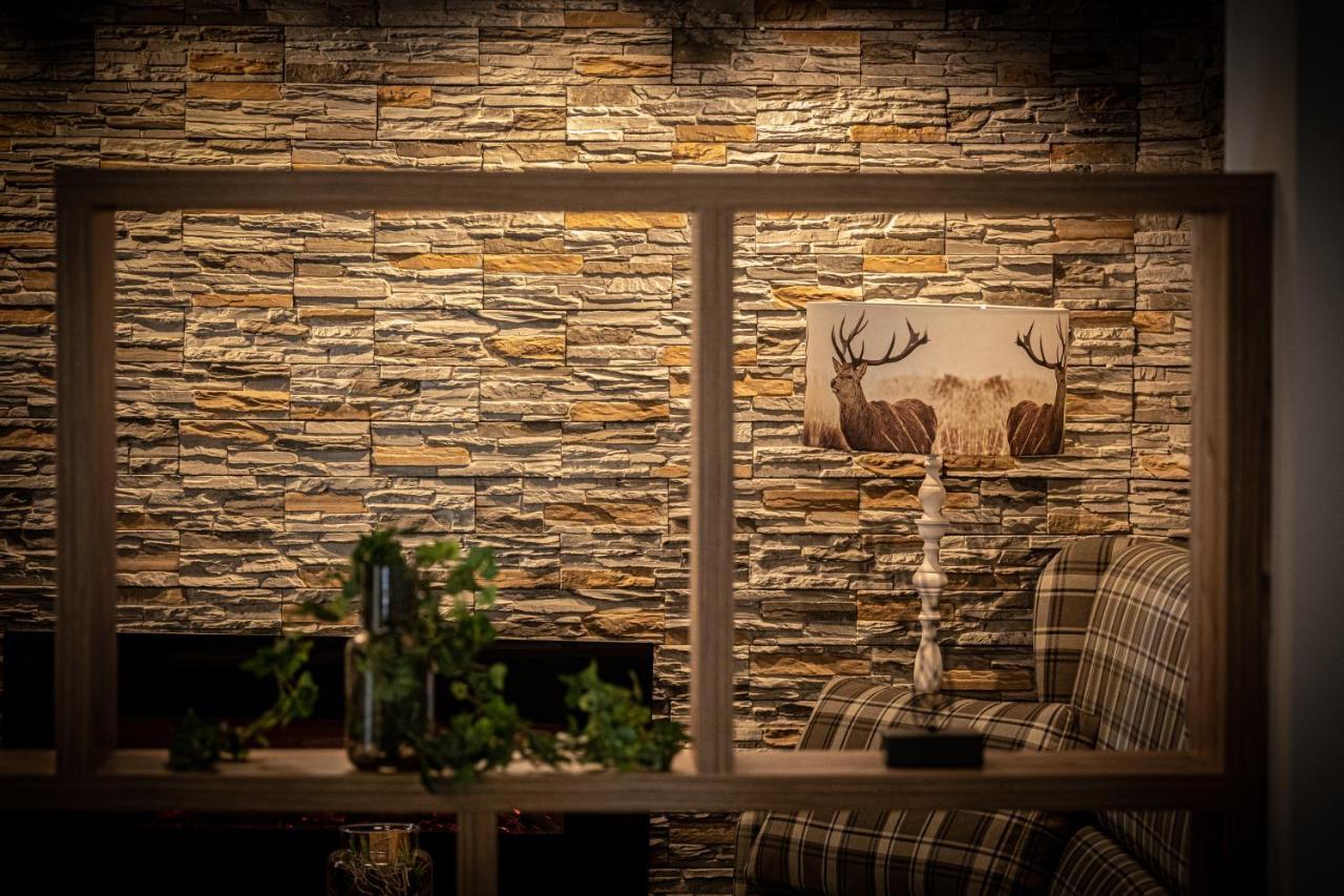 Home-Hotel Salzberg Берхтесгаден Экстерьер фото A stone wall